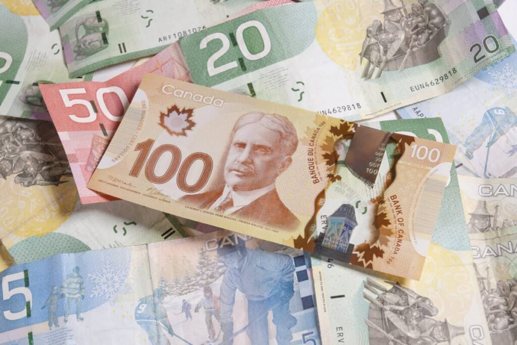 Turn a TFSA Into $300 in Monthly Tax-Free Income Paper Canadian currency of various denominations